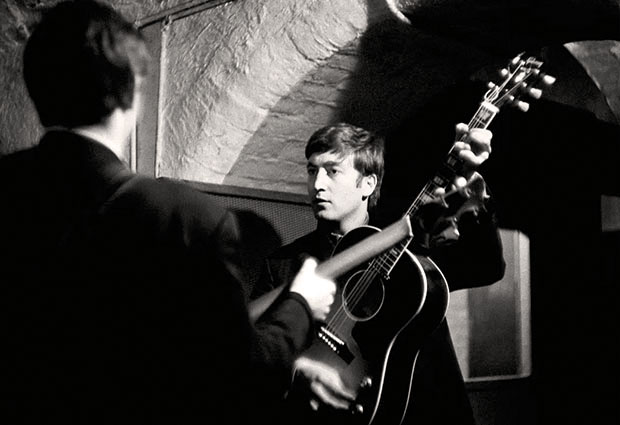 John Lennon and Paul McCartney of The Beatles rehearsing at The Cavern Club