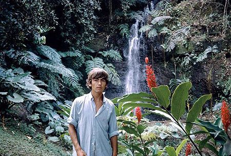 George Harrison of The Beatles Standing near Waterfall in the Mid Sixties