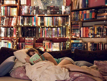 Girl Reading in Cozy Book Nook Library