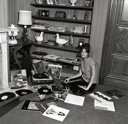 Parisian Woman in the Sixties Smoking and Playing Vinyl Records